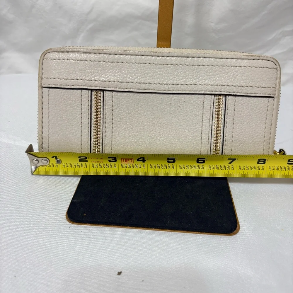 Michael Kors Moxley continental zip-around wallet in vanilla or cream leather.